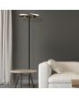 Searchlight Aerial EU62332GO sfeerfoto van zwart met goud kleurige vloerlamp met goudkleurige cirkelvormige kap met LED ring aan de binnenzijde in een woonkamer met beige gordijnen en witte bank