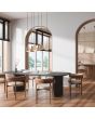 Trio Agudo 319400165 sfeerfoto van zes hanglampen in drie kleuren met in twee lagen gelaagde metalen kapje boven een stenen eettafel met houten stoelen
