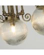 Searchlight Belvue 3259AB detailfoto van het glas van de klassiek bronzen badkamer plafondlamp in kroonvorm met drie bolvormig geribbeld glazen kappen