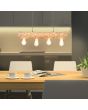 Brilliant Trabo 99432/35 sfeerfoto van hanglamp van dennenstammetje met vier brandende E27 lampen boven een houten eettafel met beige stoelen