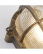 Searchlight Bulkhead 61402BG detailfoto van zwartgouden ovale buitenlamp met rooster over ribbelglas