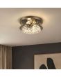 bronzen plafondlamp voor de badkamer met een diameter van 35cm en bobbelglas aan een plafond in een woonkamer