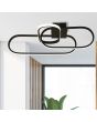 Searchlight Clip 61774BK sfeerfoto van zwarte plafondlamp van 65cm met drie ovale ringen in elkaar met LED strip aan de buitenzijde aan een rechthoekige plafondplaat aan een plafond voor een raam
