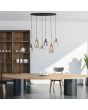 Searchlight Divine 36463-6BK sfeerfoto van hanglamp met zwarte ovale plafondplaat met zes pendels met kappen van helder, amber een rookglas in verschillende vormen boven een grote houten tafel, voor een vitrinekast