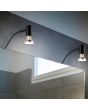 Trio Giada 283400132 sfeerfoto van twee zwarte kastlampen met richtbaar spotje boven een spiegelkast