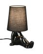 Brandende Reality Huma zwarte tafellamp van 24,5 cm hoog met lampvoet in de vorm van een zittend lichaam en een kapje van textiel als hoofd