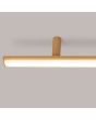 Detailfoto eindstuk goudkleurig langwerpige plafondlamp Lagom van 181 cm lang met kort in het midden onderbroken LED unit over de gehele lengte