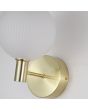 Detailfoto van het glas en de houder van de Searchlight Luminique mat messing wandlamp van 27cm hoog met een staande kap van bolvormig mat geribbeld glas