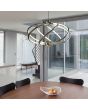 Searchlight Magic 6500-7CC sfeerfoto van chromen hanglamp met zeven armen samen een ovaal vormend met LED strips aan de binnenzijde boven een zakelijk bureau