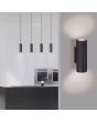 Trio Marley 212400232 sfeerfoto van mat zwarte buisvormige wandlamp van metaal voor twee GU10 lampen aan een wand voor een keuken