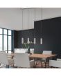 Trio Marley 312400407 sfeerfoto van hanglamp met staalkleurige plafondbalk en vier pendels met cilindervormige kap met een GU10 lampje boven een moderne eettafel