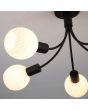 Searchlight Nova 54715-5BK detailfoto van drie van de glazen van de zwarte plafondlamp met vijf armen met elk een opaal wit glazen bolletje met strepen