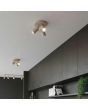 sfeerfoto van twee taupe kleurig rond metalen plafondspots met een diameter van 26 cm en drie spotjes langs een kastenwand