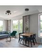 Trio Romeo 337030532 sfeerfoto in een modern appartement van zwarte ronde hanglamp met vijf kegelvormige kappen met LED rand in de kegel en liftfunctie in de plafondbalk. Met schakelaar voor het instellen van de lichtkleur.
