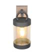 Trio Sambesi 204160135  van boven genomen foto van brandende wandlamp voor buiten met een rechthoekige houtkleurige wandplaat en antraciet grijze hangende cilindervormige kap met dag nacht sensor