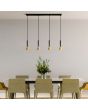 Searchlight Signal 13611-4BGO sfeerfoto van hanglamp met zwarte plafondbalk en vier pendels met zwart buisvormige kap met goud kleurig kegelvormig uiteinde boven een marmeren eettafel met goudkleurige stoelen