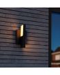 Sfeerfoto van Lutec Twisto antraciet grijze wandlamp voor buiten van 15,1 cm hoog met een naar links en naar rechts gericht draaibaar LED paneel