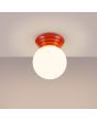 Brandende Sollux Zori perzikkleurige badkamerlamp voor wand of plafondmontage met een wit glazen bol van 12 cm in diameter